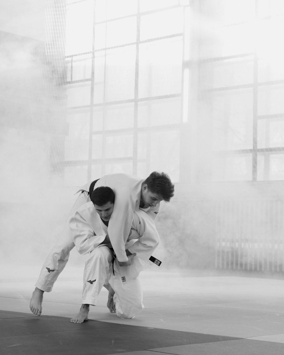 a guy throwing another guy in a white gi