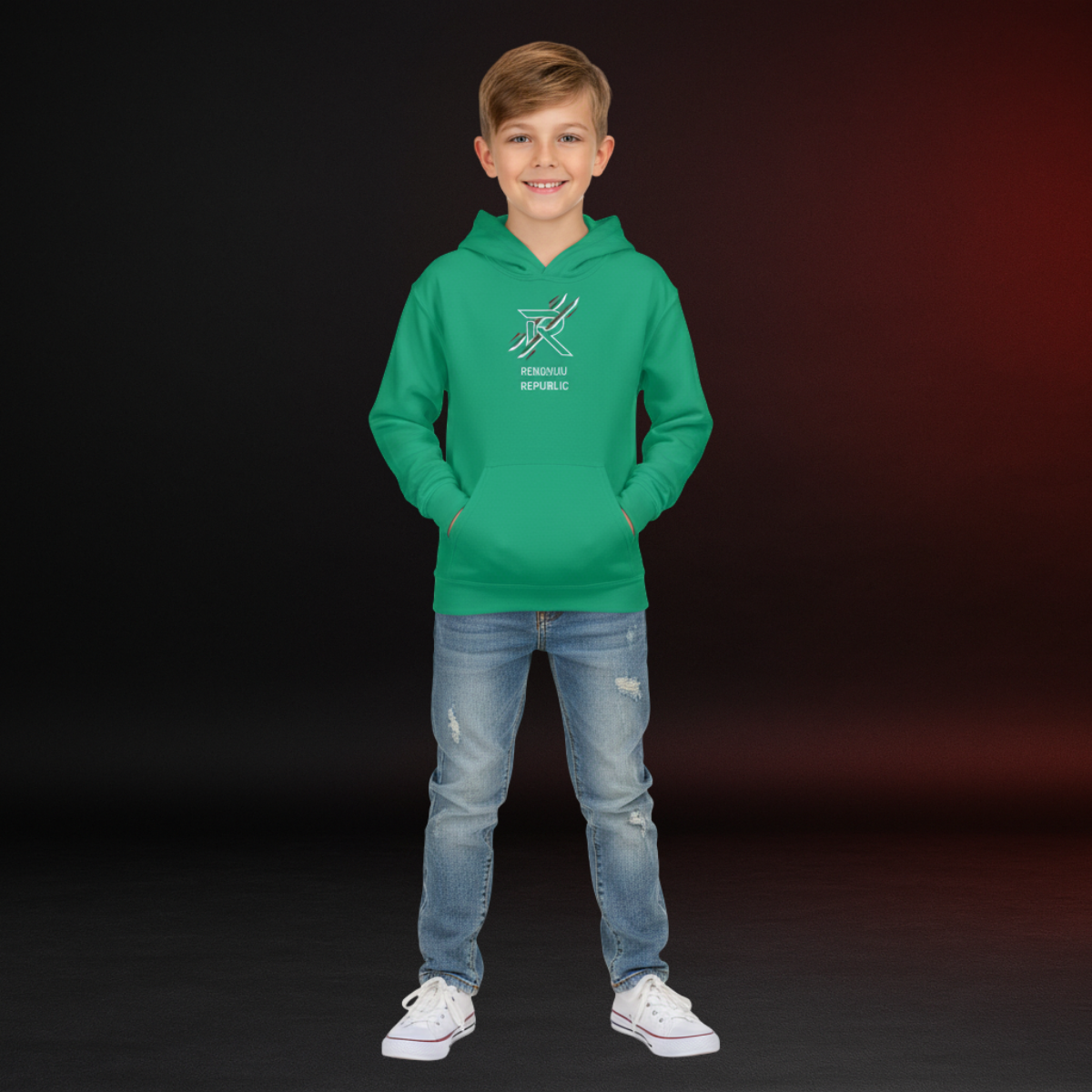 Child wearing a green hoodie with a logo and text, standing against a dark background