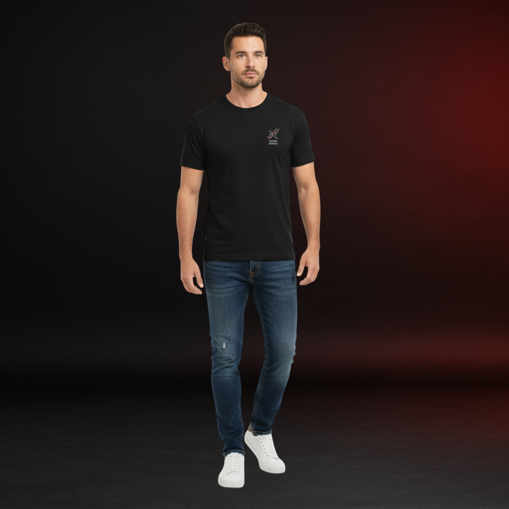 Man wearing a black t-shirt and blue jeans against a dark background