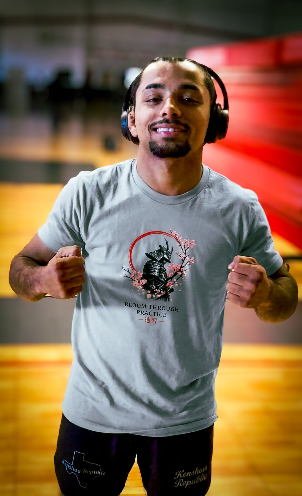 Man wearing headphones and a t-shirt with a graphic design in an indoor setting