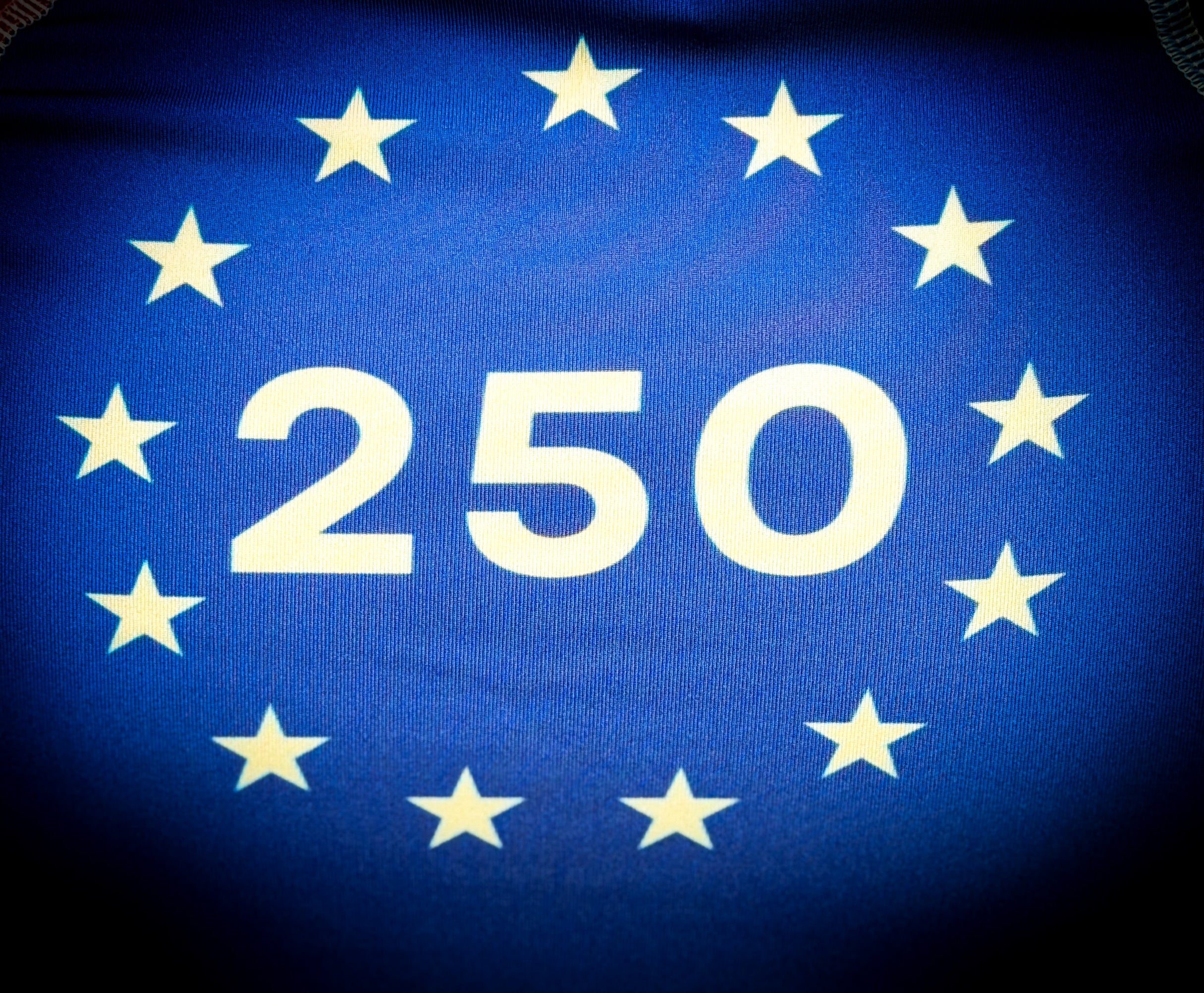 Number 250 surrounded by stars on a blue background