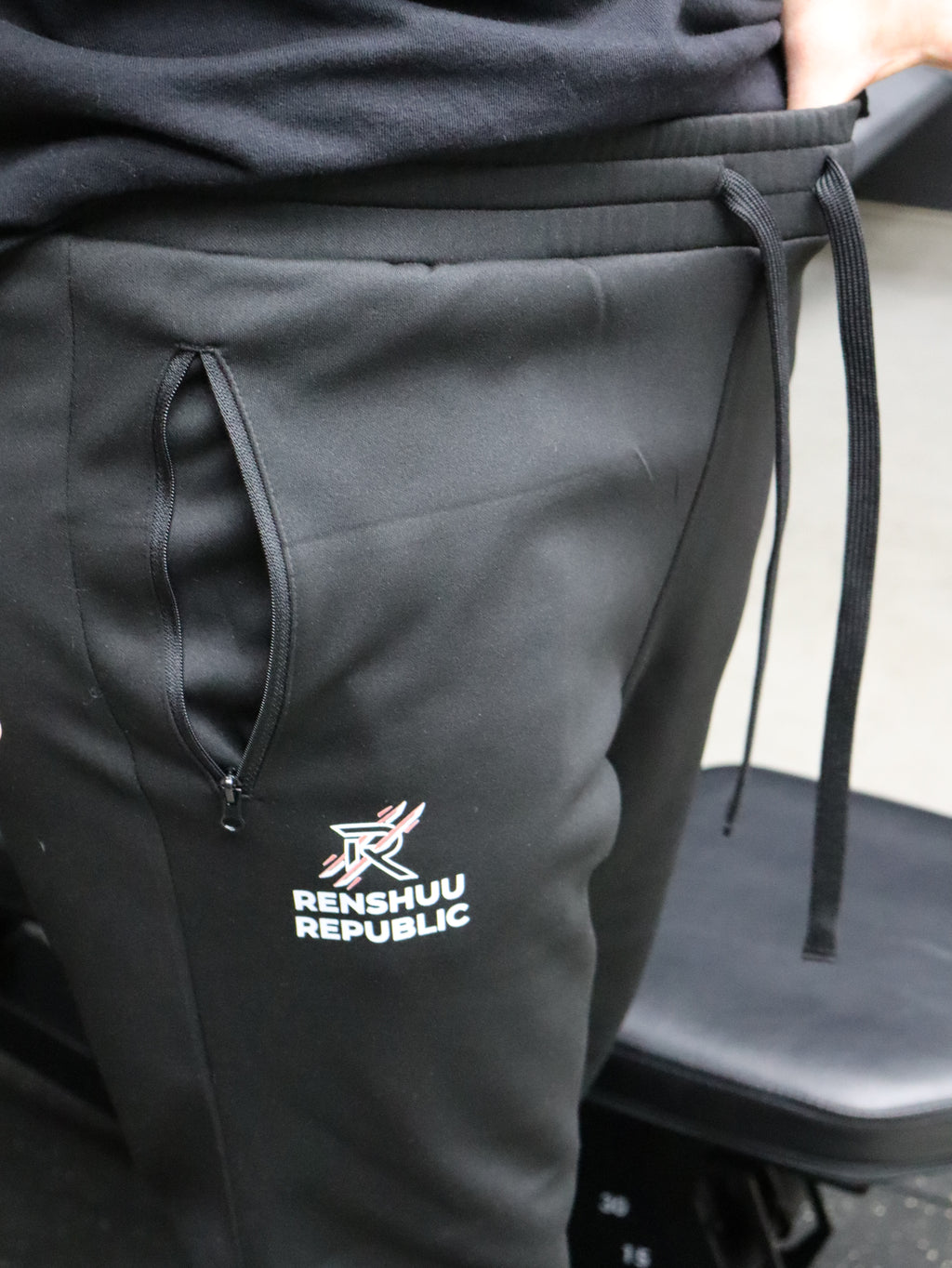 Black jacket with a visible brand logo on a mannequin