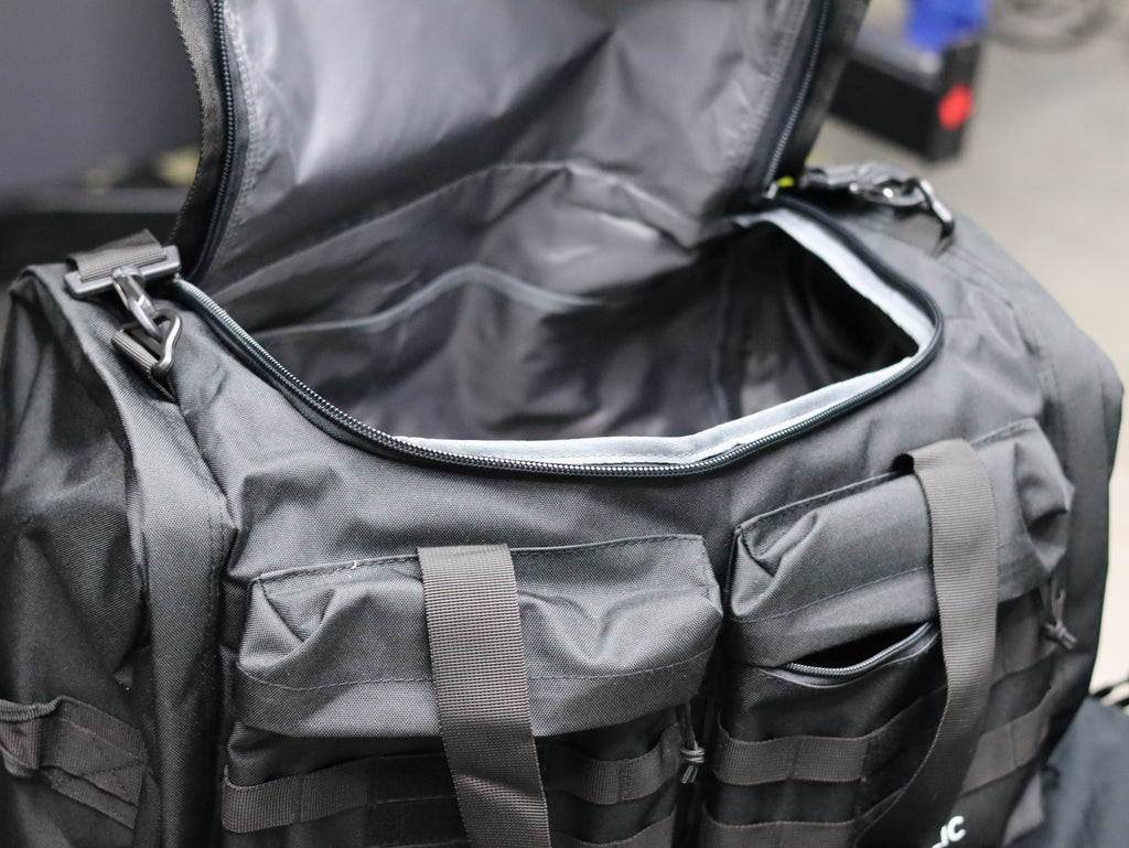Gray tactical bag with multiple pockets and zippers